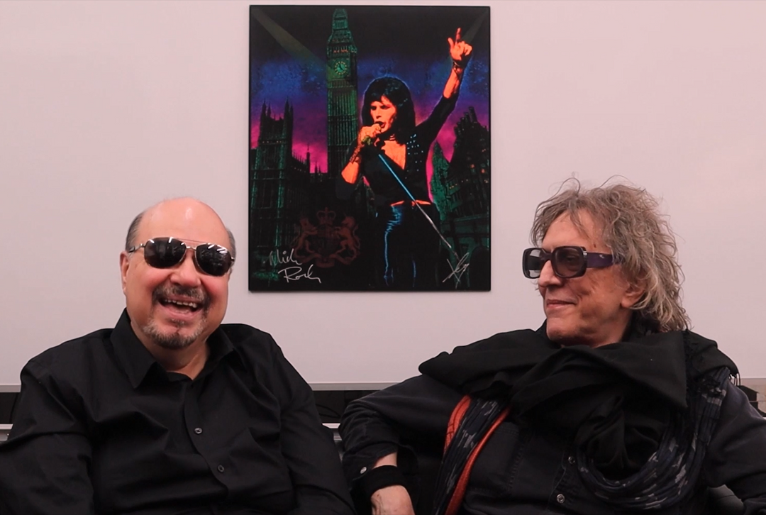 Mick Rock and ioannis talking in front of their Freddie Mercury portrait collaboration