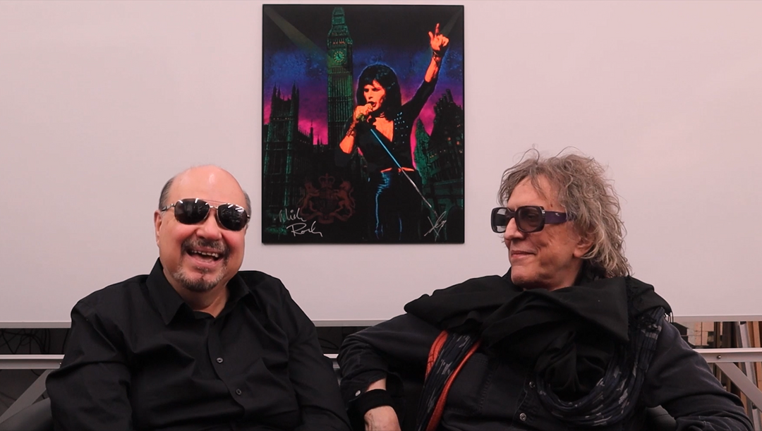 Ioannis and Mick Rock talking in July 2021