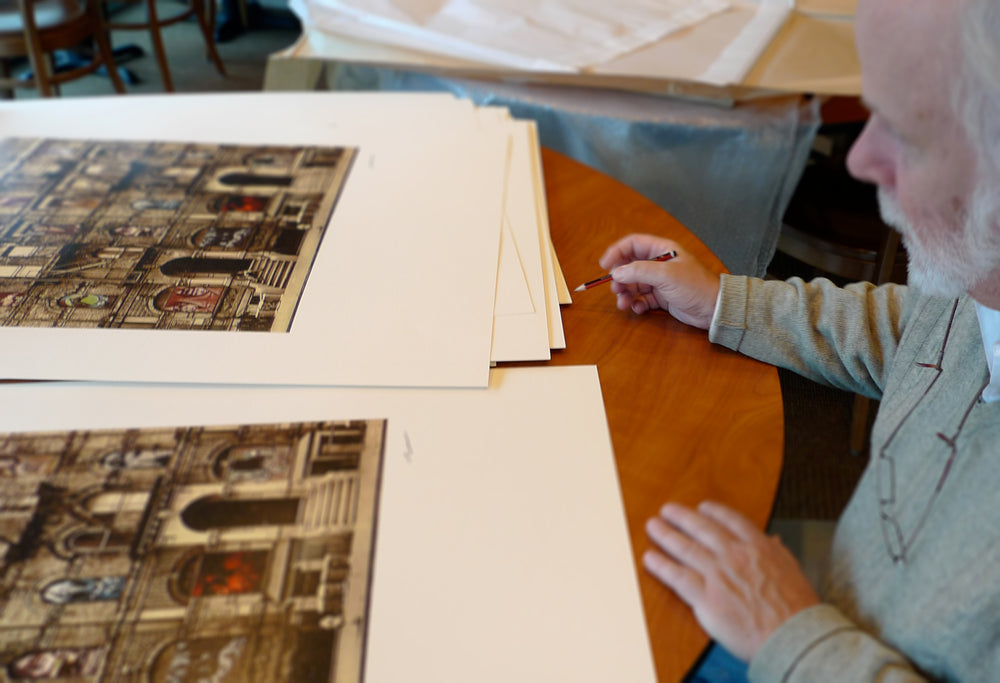 Photo of Peter Corriston signing the Led Zeppelin Physical Graffiti print at his home in New York State.